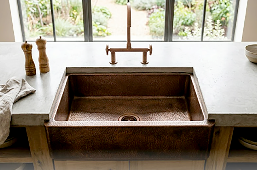 Drop in copper sink with artisanal hammered surface
